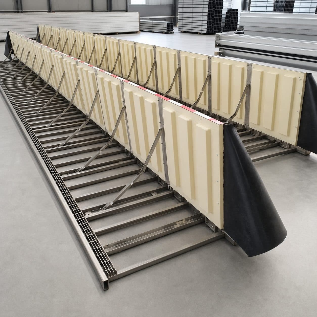 Hydrodynamic passive flood barrier at an industrial gate